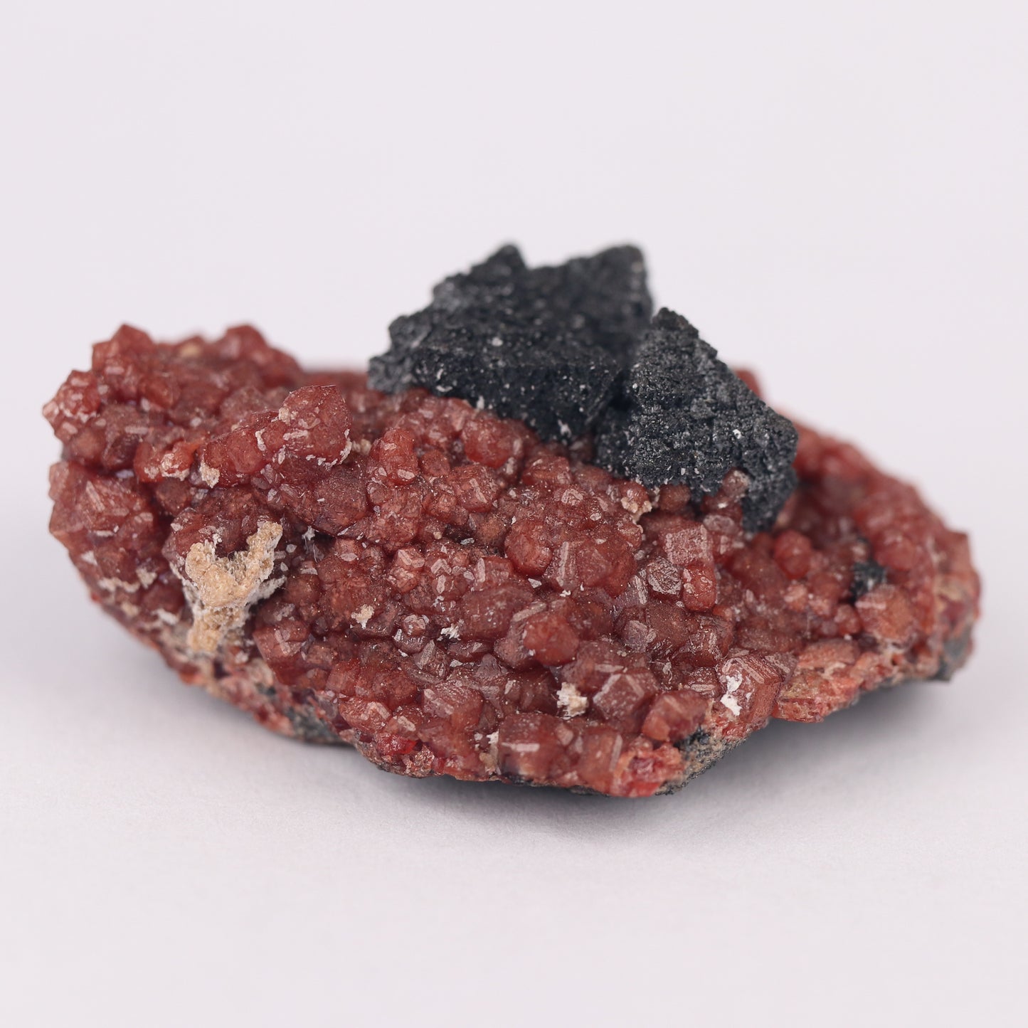 Hausmannite on Andradite