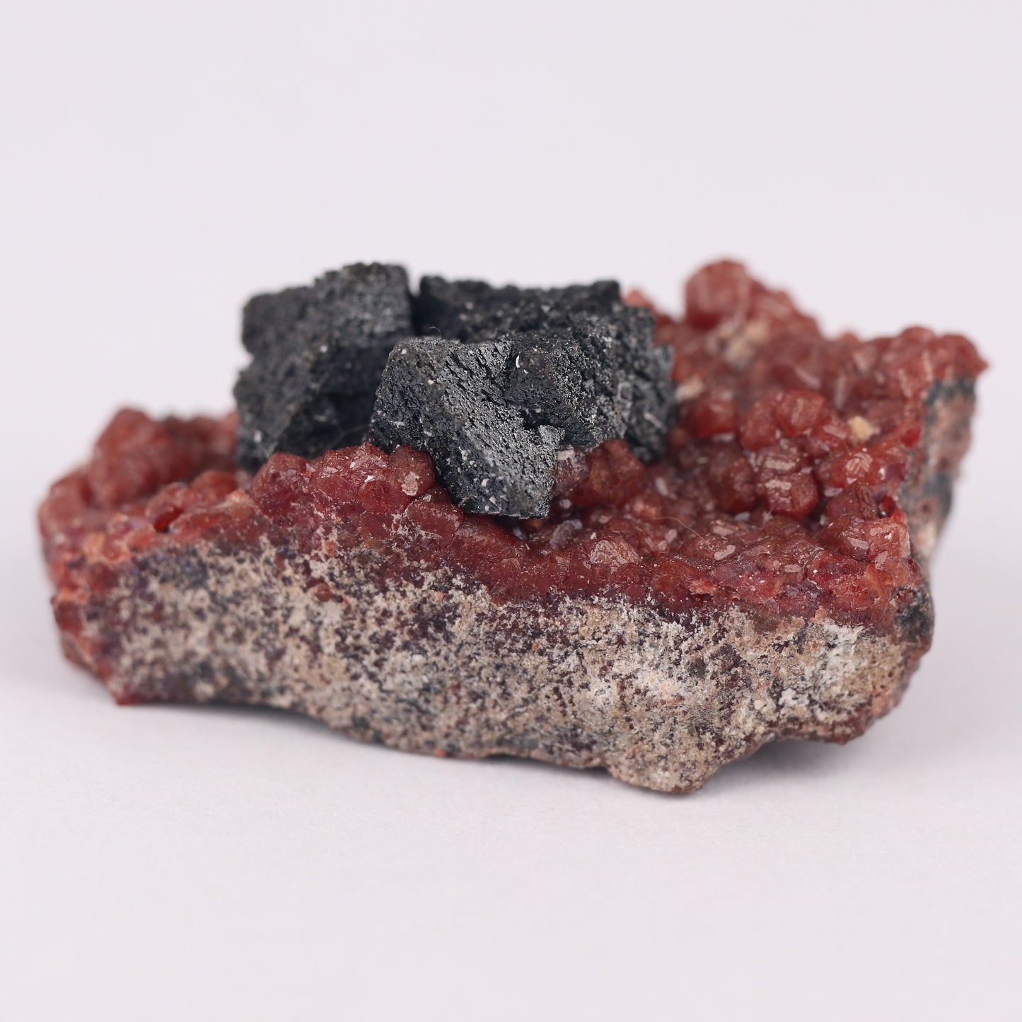 Hausmannite on Andradite