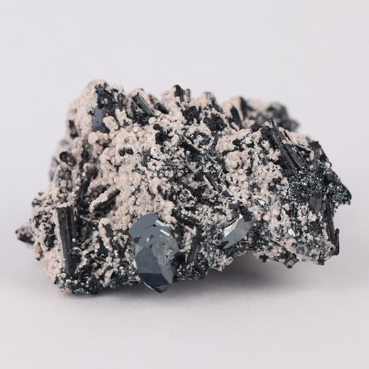 Brucite on Hematite on Gaudefroyite