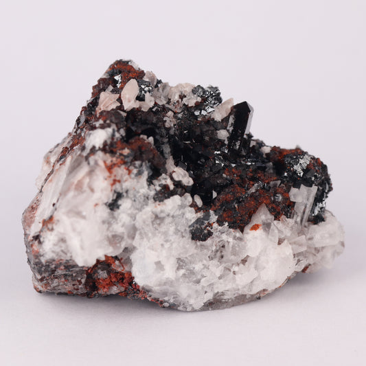 Andradite, Baryte, Hausmannite on Manganvesuvianite