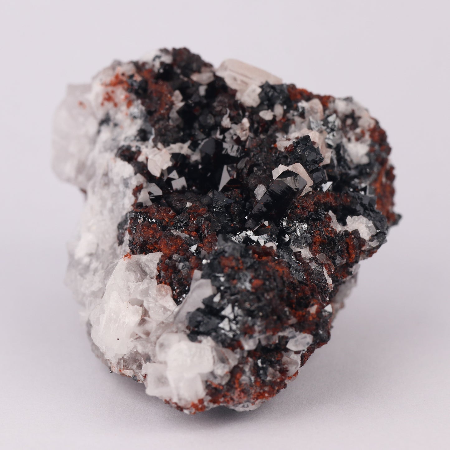 Andradite, Baryte, Hausmannite on Manganvesuvianite