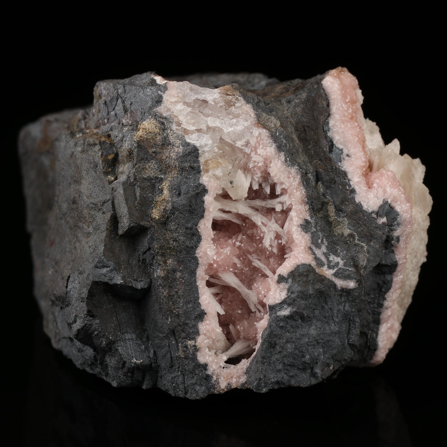 Calcite on Rhodochrosite on Matrix