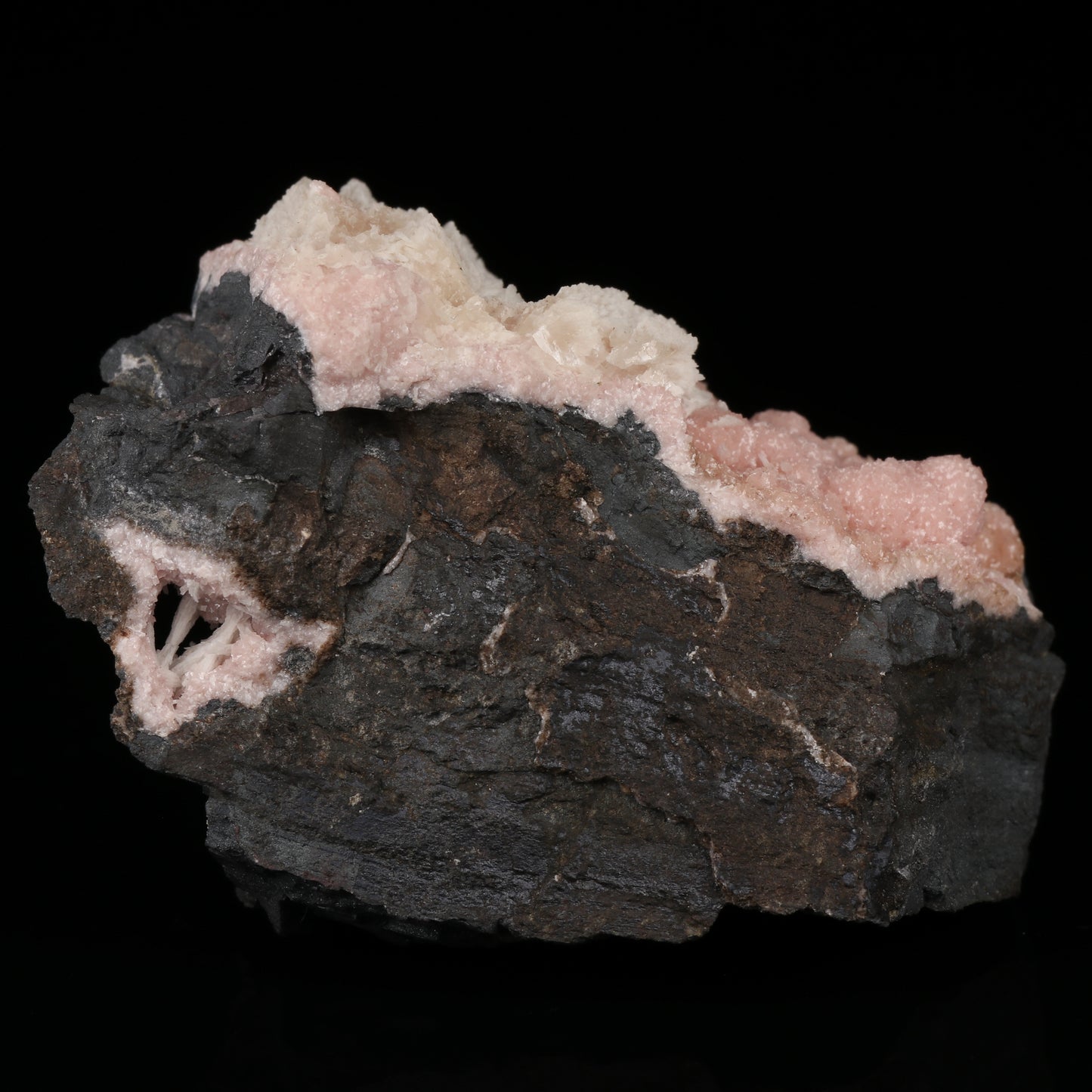 Calcite on Rhodochrosite on Matrix