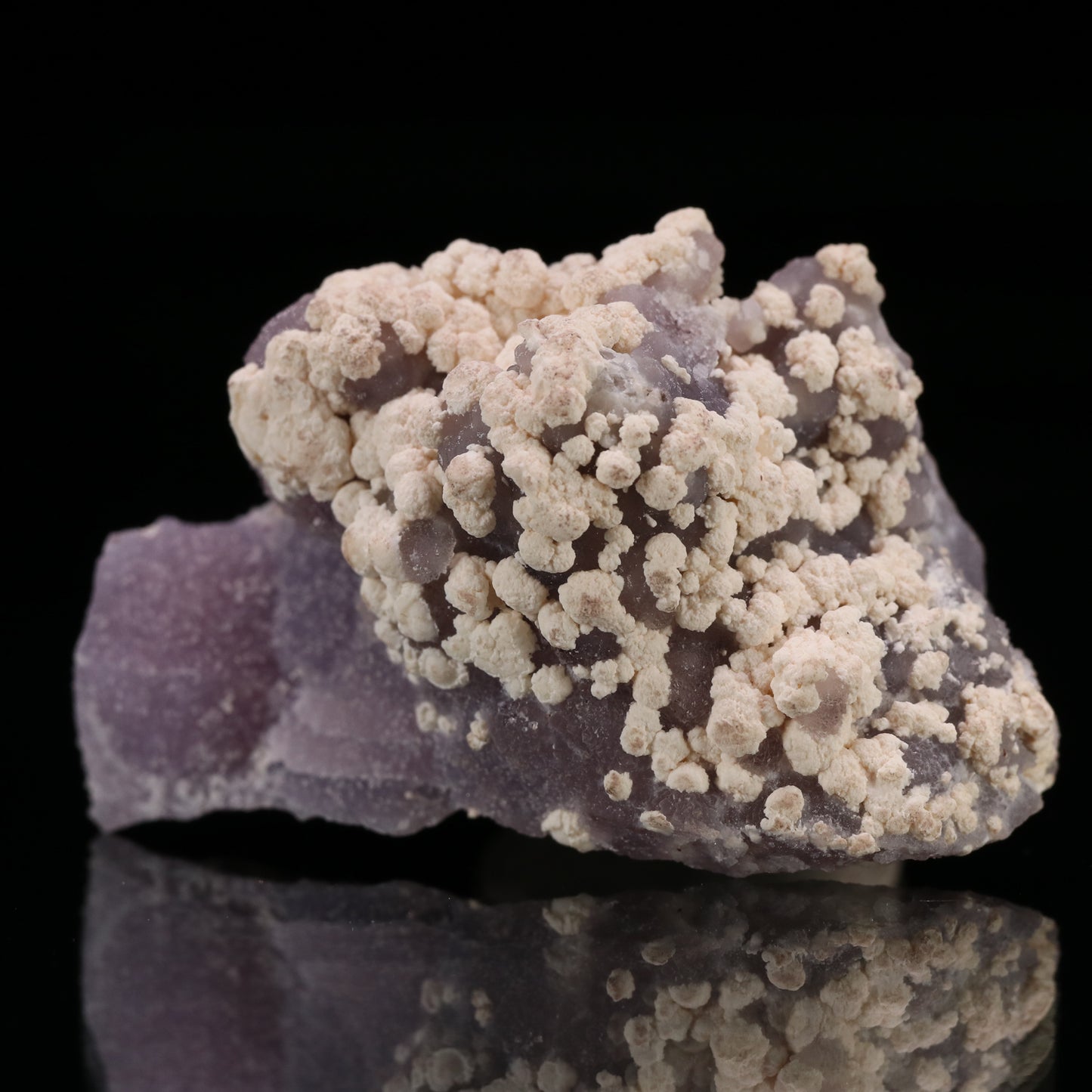 Calcite on Amethyst Quartz, N'Chwaning III Mine, Kalahari Manganese Field, Northern Cape, South Africa.