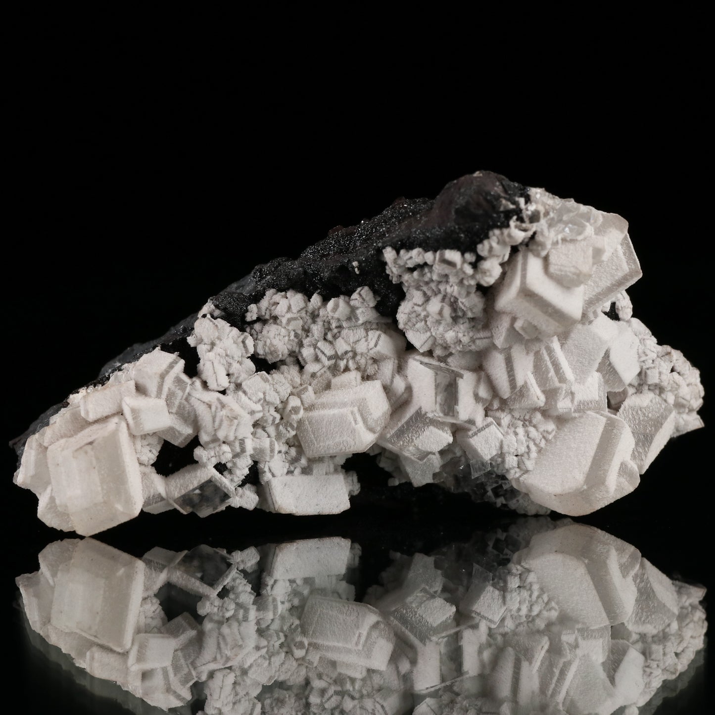 Calcite on Manganite on Matrix, N'Chwaning II Mine, Kalahari Manganese Field, Northern Cape, South Africa.