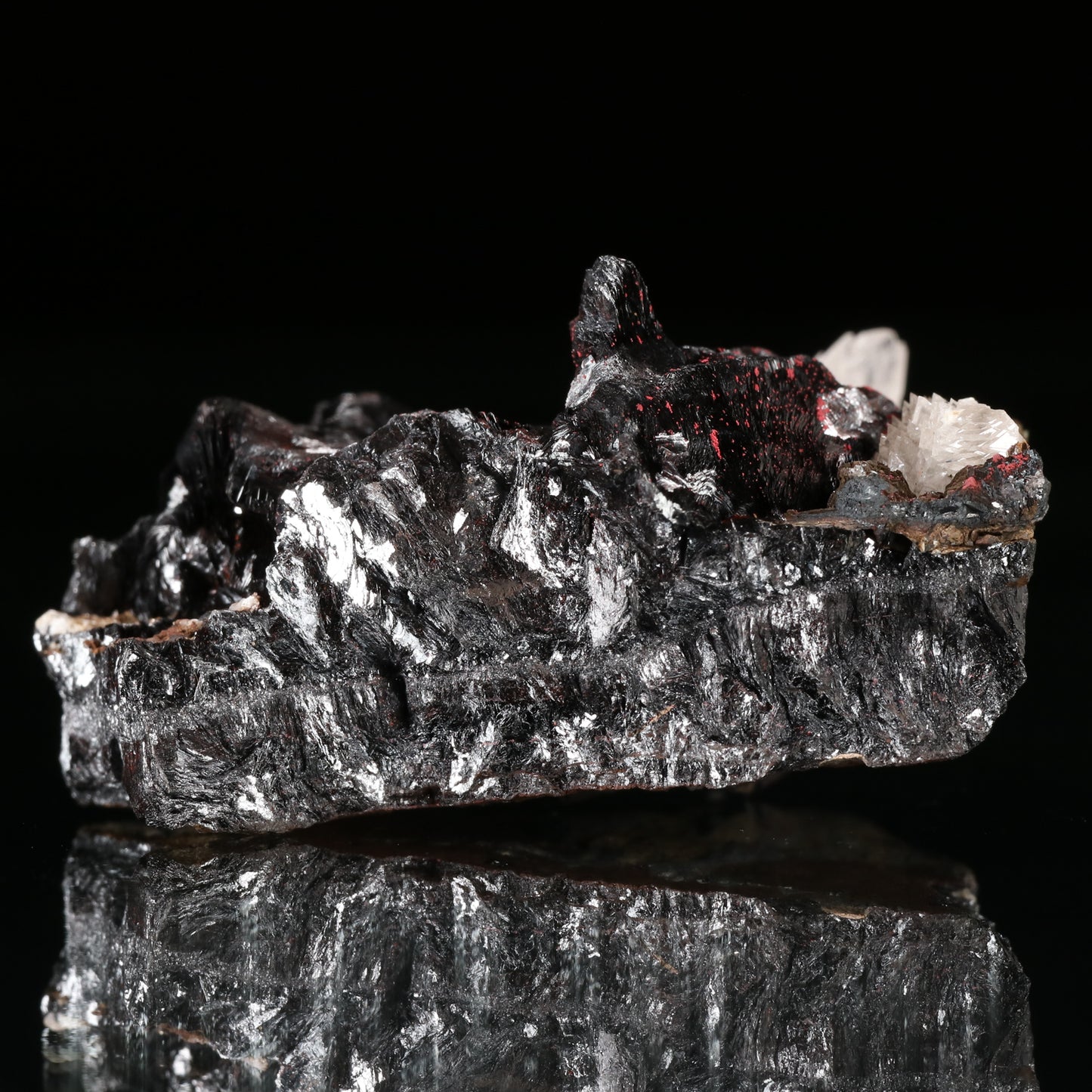 Calcite, Cinnabar on Hausmannite, N'Chwaning II Mine, Kalahari Manganese Field, Northern Cape, South Africa.