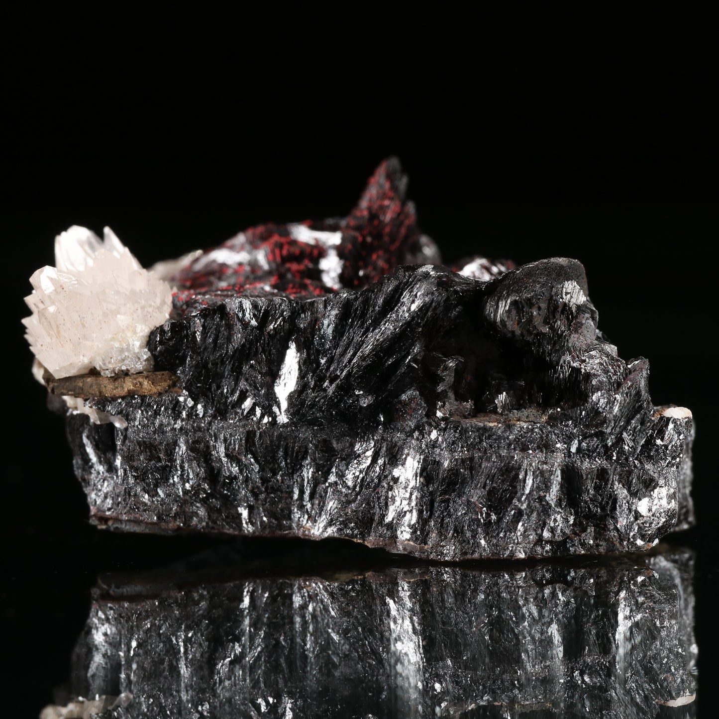 Calcite, Cinnabar on Hausmannite, N'Chwaning II Mine, Kalahari Manganese Field, Northern Cape, South Africa.