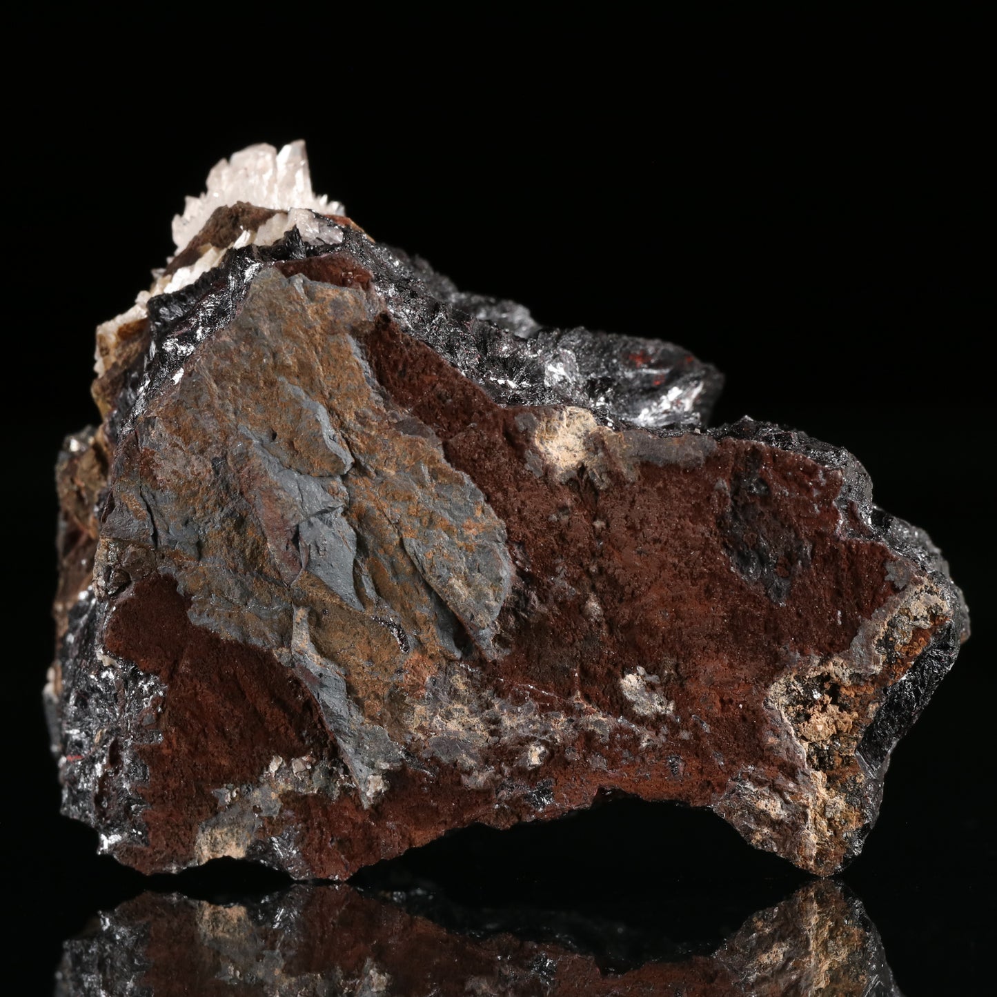 Calcite, Cinnabar on Hausmannite, N'Chwaning II Mine, Kalahari Manganese Field, Northern Cape, South Africa.