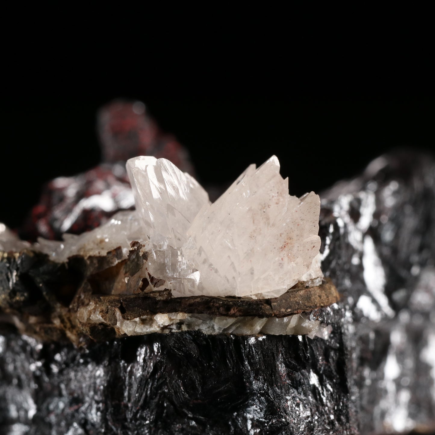 Calcite, Cinnabar on Hausmannite, N'Chwaning II Mine, Kalahari Manganese Field, Northern Cape, South Africa.