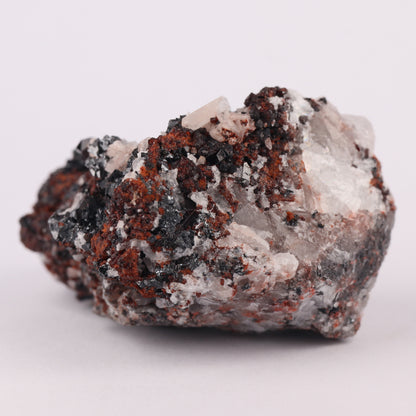 Andradite, Baryte, Hausmannite on Manganvesuvianite