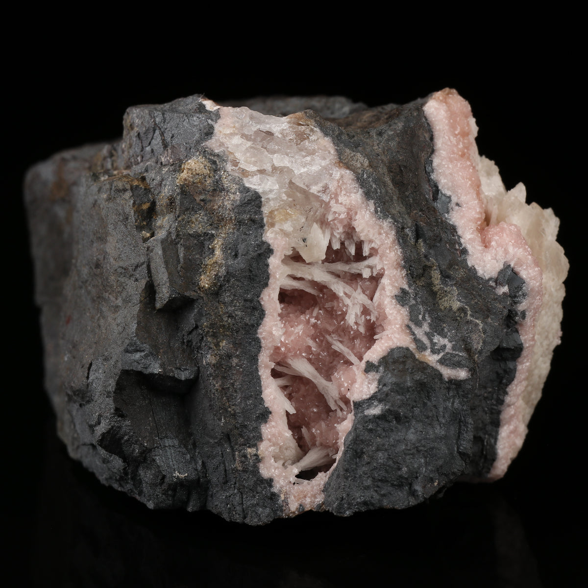 Calcite on Rhodochrosite on Matrix
